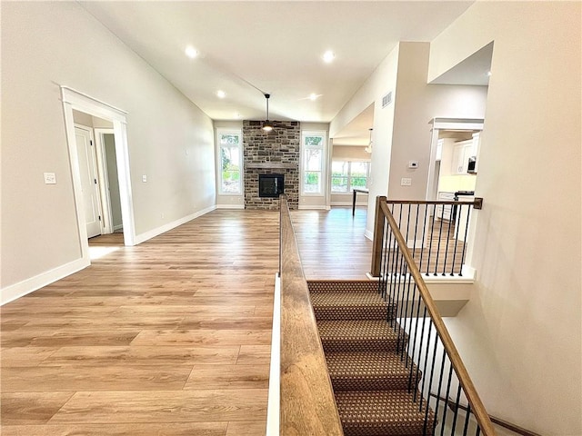 unfurnished living room with a fireplace and light hardwood / wood-style flooring