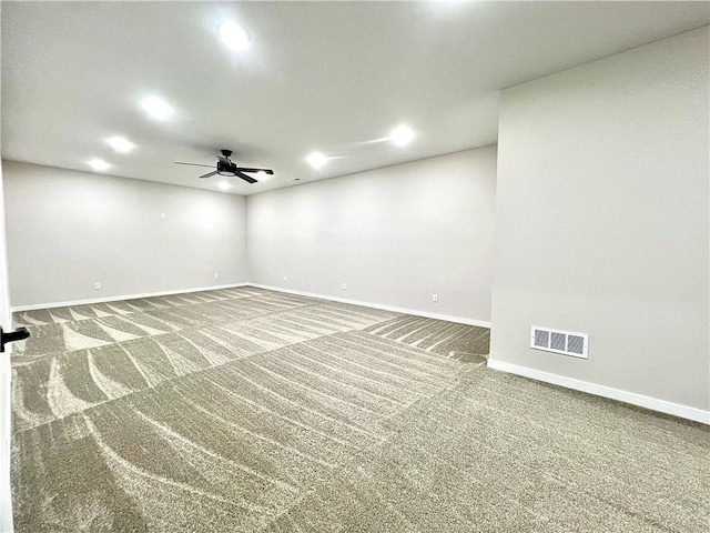 carpeted empty room featuring ceiling fan