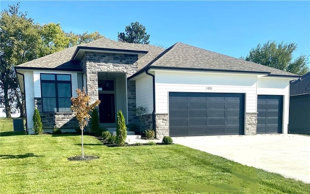 view of front facade with a garage and a front lawn