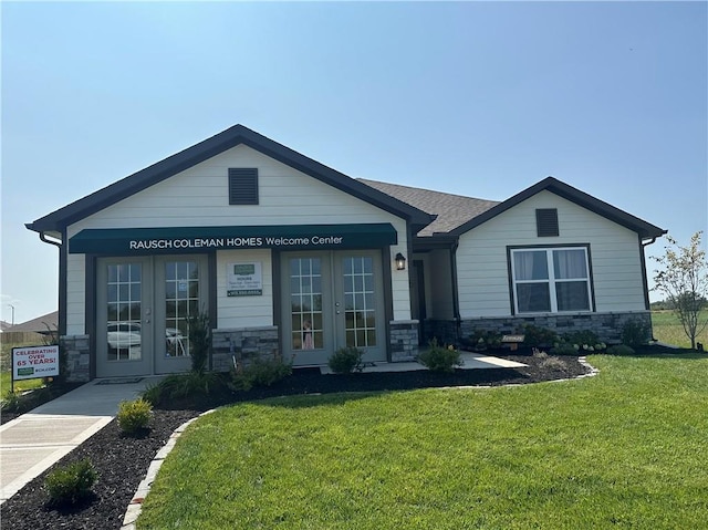 20385 W 193rd Ln, Spring Hill, KS 66083 - view of front facade featuring french doors, stone siding, and a front yard