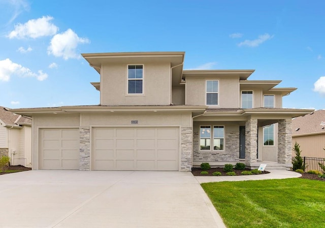 prairie-style home with a garage and a front yard