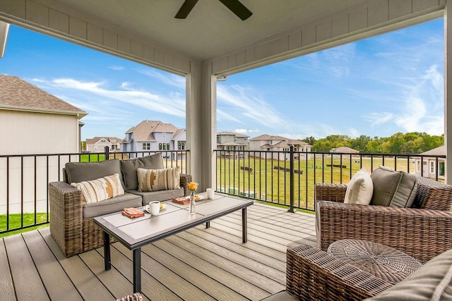 wooden terrace with outdoor lounge area and ceiling fan