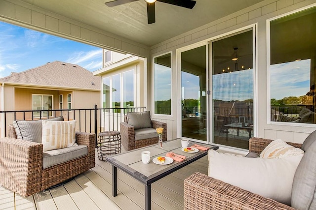 sunroom / solarium featuring ceiling fan