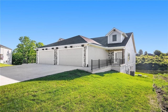 view of front of property with a garage and a front lawn