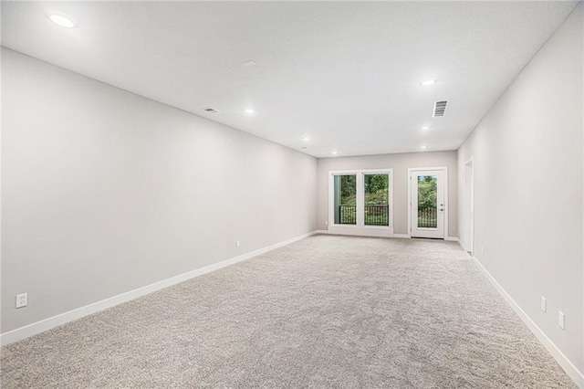 empty room with light colored carpet