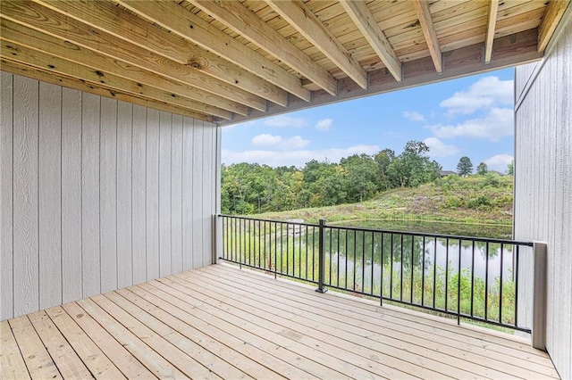 wooden deck featuring a water view