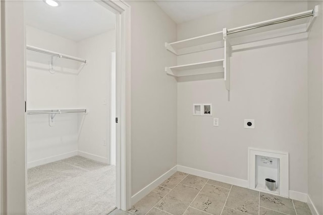 washroom with hookup for a washing machine, hookup for an electric dryer, and light colored carpet