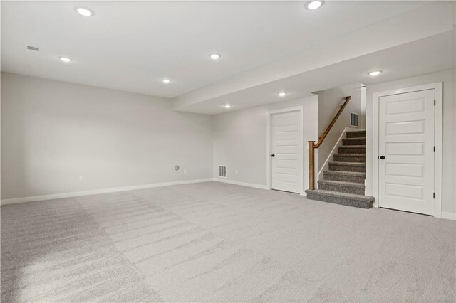 basement with light colored carpet