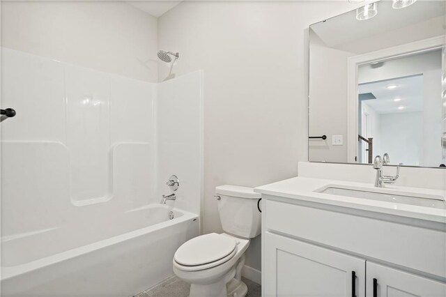 full bathroom with shower / washtub combination, vanity, and toilet