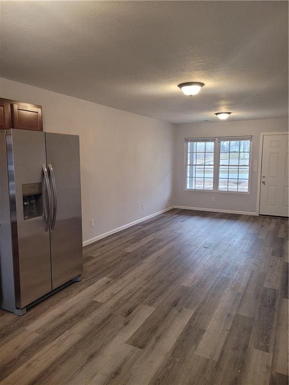 kitchen featuring dark hardwood / wood-style floors and stainless steel refrigerator with ice dispenser