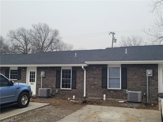 ranch-style house with central AC unit