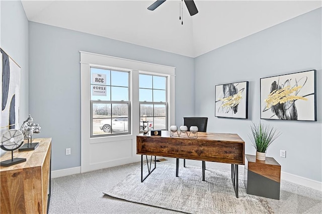 carpeted office space featuring ceiling fan and lofted ceiling