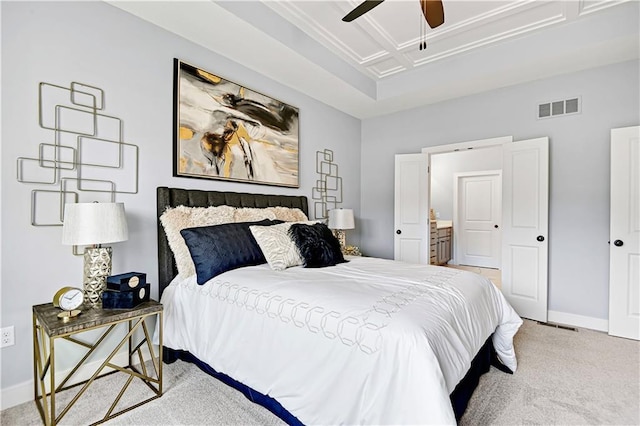 carpeted bedroom featuring ensuite bathroom and ceiling fan