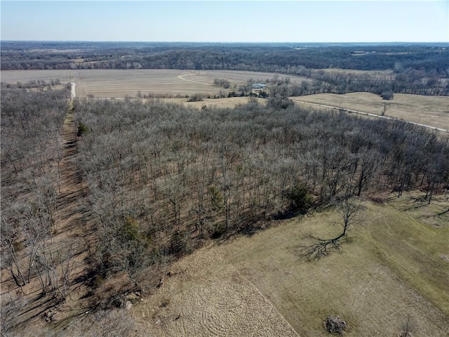 birds eye view of property with a rural view