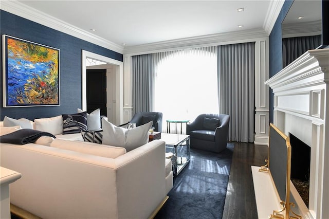 living room with a high end fireplace, crown molding, and dark hardwood / wood-style floors