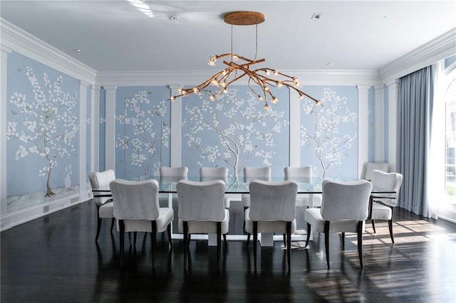 dining area featuring crown molding, dark hardwood / wood-style flooring, decorative columns, and a notable chandelier