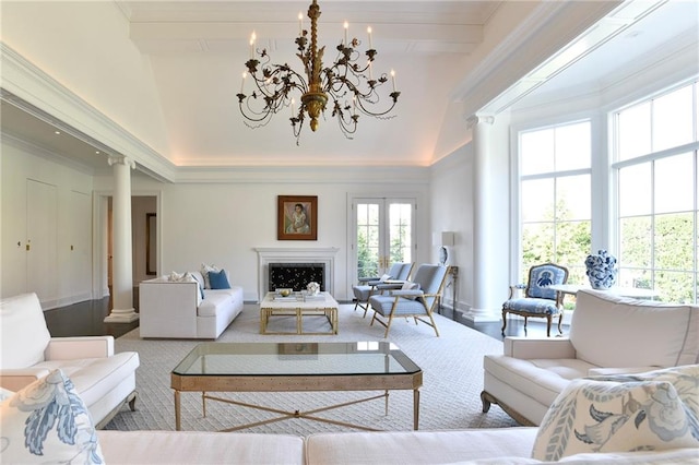 living room with high vaulted ceiling and a chandelier