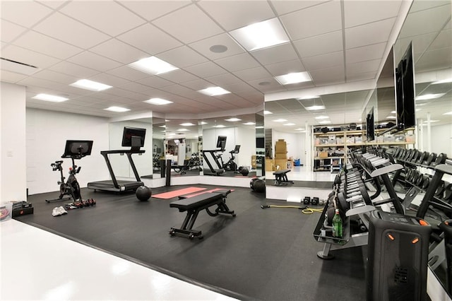 exercise room with a drop ceiling