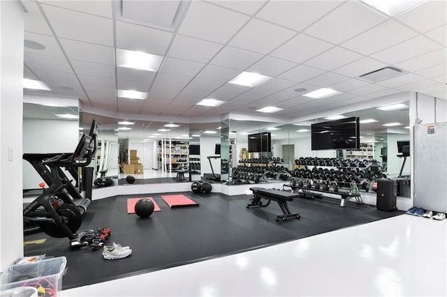 workout area featuring a drop ceiling