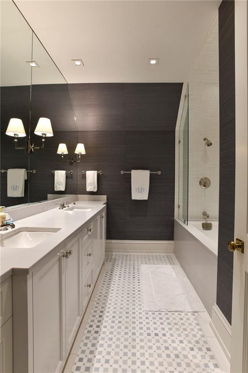 bathroom featuring bathing tub / shower combination and vanity