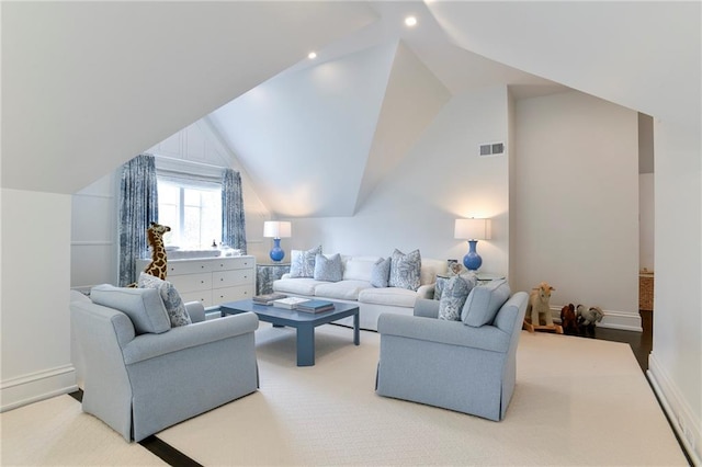 living room featuring lofted ceiling and carpet flooring