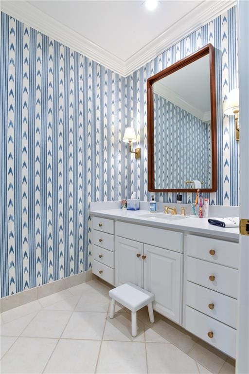 bathroom with crown molding, vanity, and tile patterned floors