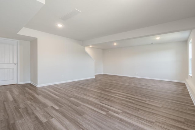 spare room with hardwood / wood-style floors