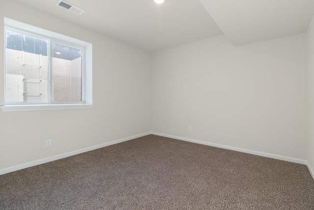 spare room featuring carpet floors