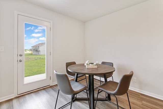 10298 Lucca Ln, Peculiar, MO 64078 - dining room featuring wood finished floors and baseboards