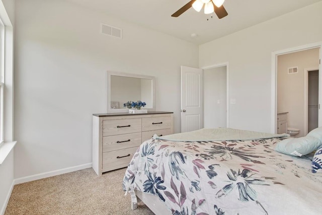 10298 Lucca Ln, Peculiar, MO 64078 - bedroom with light colored carpet, baseboards, ensuite bath, and ceiling fan
