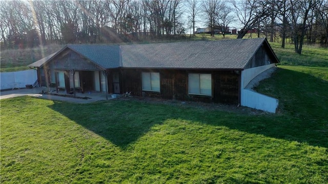 single story home featuring a patio and a front yard