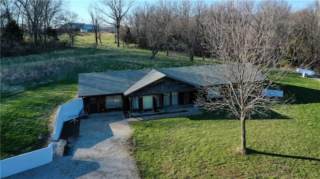 single story home featuring a front yard and a carport