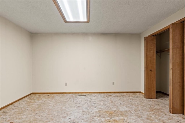 unfurnished bedroom featuring a closet and a textured ceiling