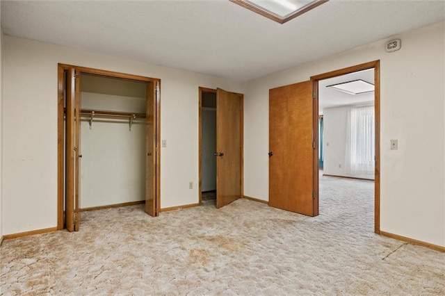 unfurnished bedroom with a closet and carpet flooring