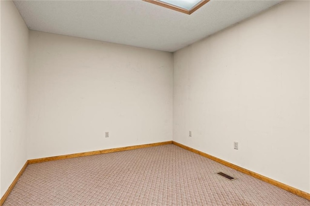 empty room featuring carpet floors