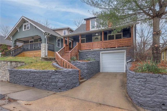 view of front of home featuring a porch and a garage