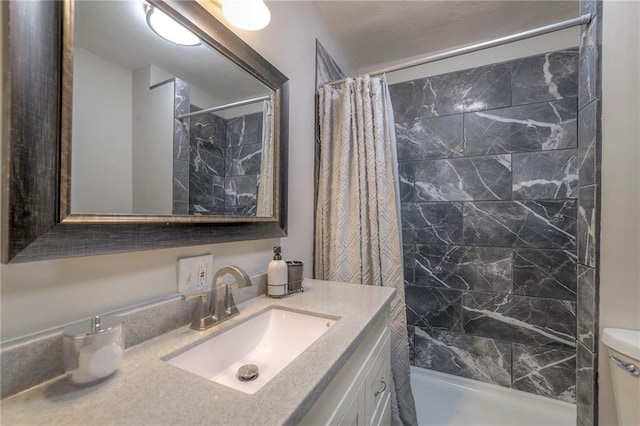 full bathroom with shower / bath combo, toilet, and vanity with extensive cabinet space