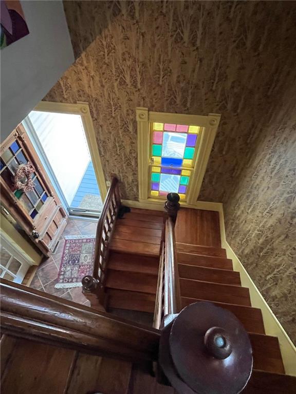 staircase featuring tile floors