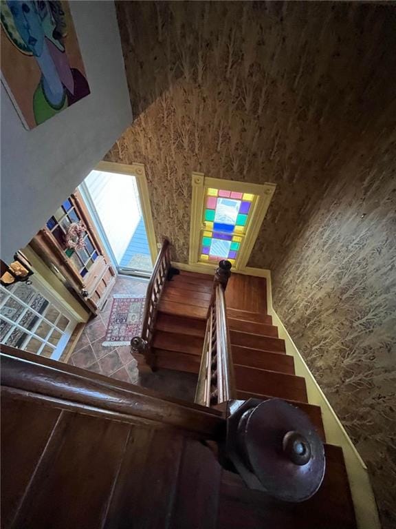 stairs featuring a towering ceiling