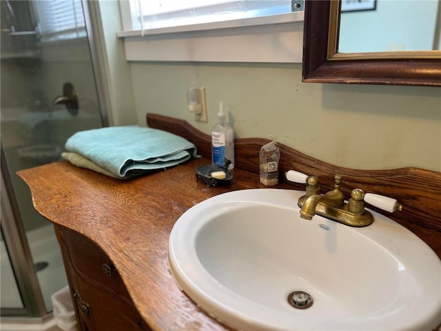 room details featuring walk in shower and vanity