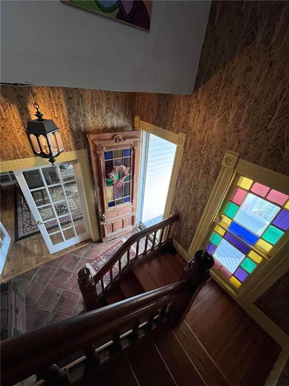 stairs featuring hardwood / wood-style floors