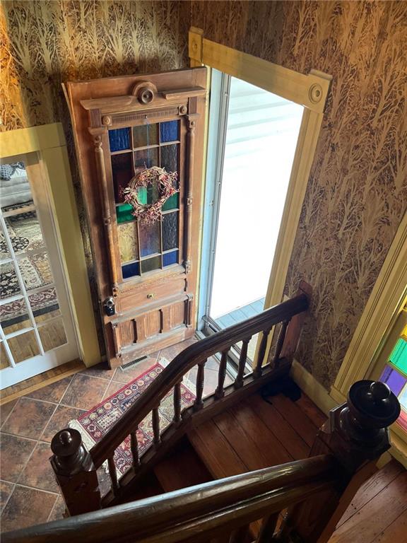 staircase featuring tile floors