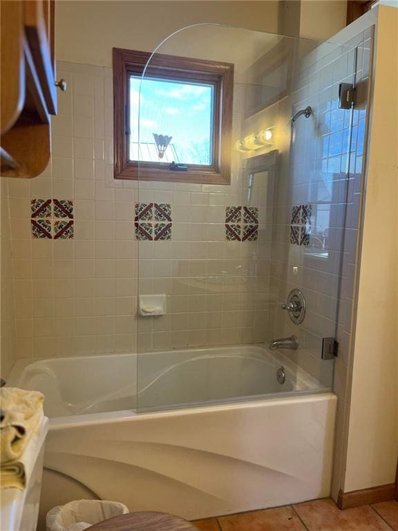 bathroom featuring tile flooring and tiled shower / bath