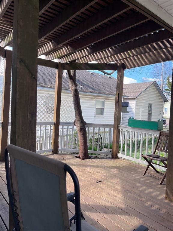 wooden terrace with a pergola