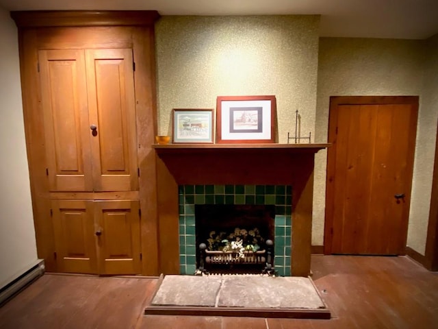 living room featuring a baseboard radiator and hardwood / wood-style flooring