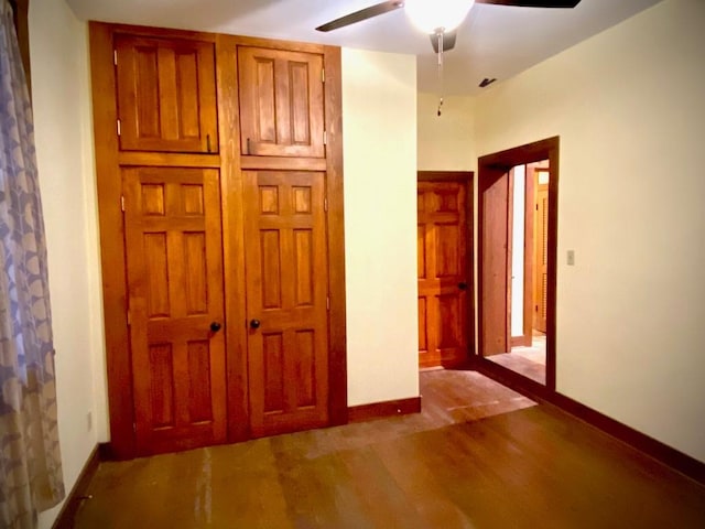 unfurnished bedroom featuring ceiling fan and wood-type flooring