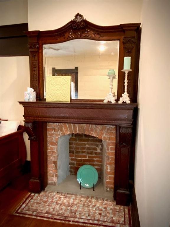 interior space featuring a fireplace and dark wood-type flooring