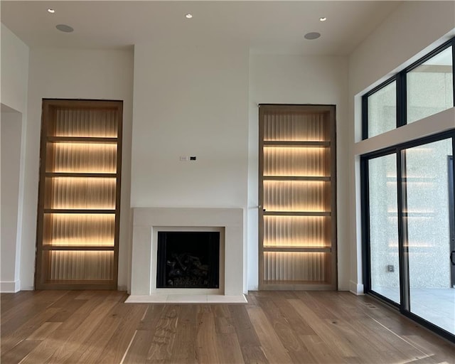 unfurnished living room with hardwood / wood-style floors