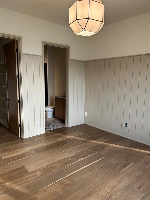 empty room with hardwood / wood-style floors