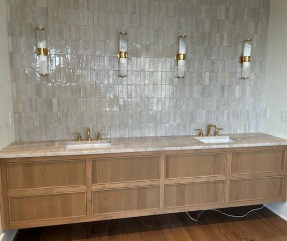 bathroom with backsplash, vanity, wood-type flooring, and walk in shower